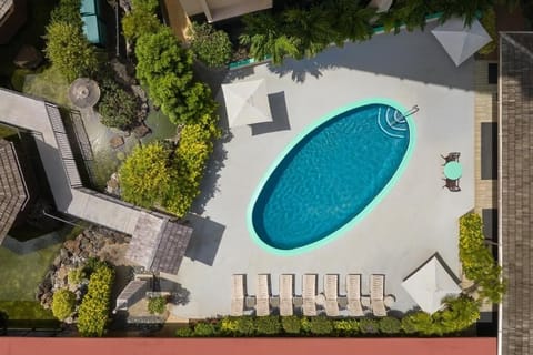 Dip into the sparkling pool, then lounge under blue skies.