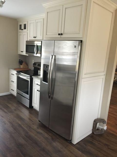 The stainless steel appliances are handy in this kitchen. Country meets modern!