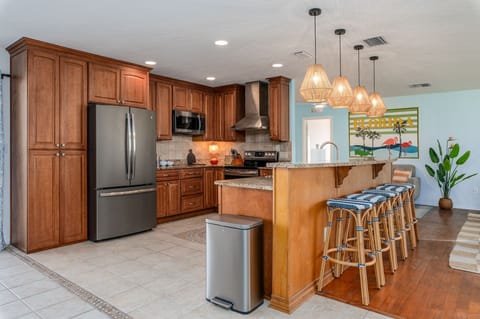 A chef's dream and a foodie's paradise! With modern appliances and plenty of counter space, our kitchen is ready for your vacation creations. What's on the menu?