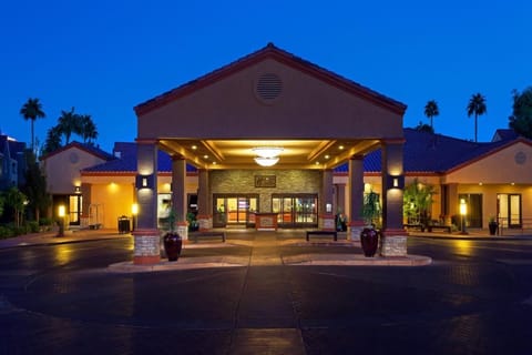 Arrive in style under a warmly lit, welcoming entrance.
