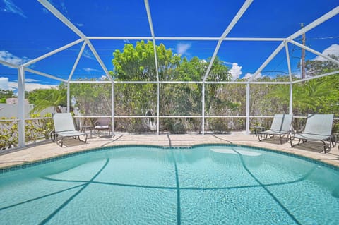 Coral Cove - Plenty of lounge chairs and seating around the private landscaped heated pool.