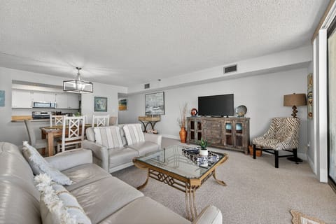 Cozy lounge setup centered around a media console, ideal for relaxed evenings inside.