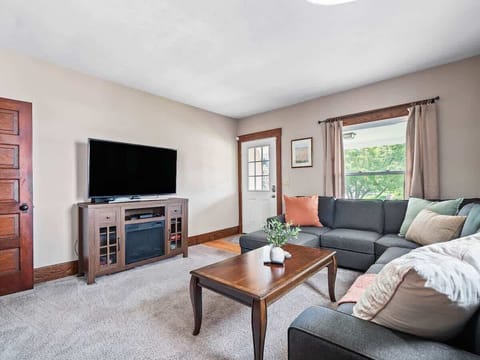 Cozy living room with comfy sectional sofa, smart TV & natural light ️✨