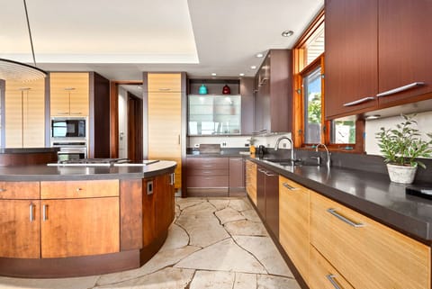 Gourmet kitchen with warm wood cabinetry.