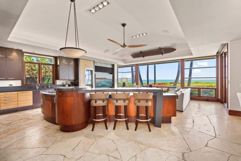 Kitchen island with seating and ocean views.