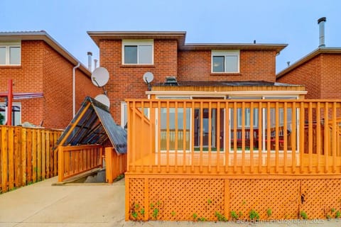 A welcoming exterior with a beautifully maintained front entrance and lush greenery.