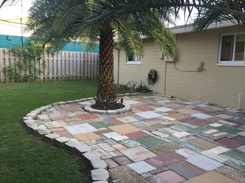 Eclectic mosaic pavers make a wonderful and unique patio.