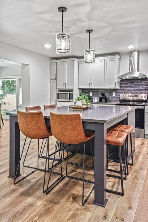 Cook with ease in this fully stocked kitchen with island seating.