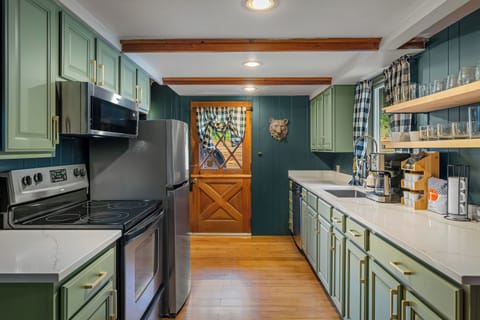 [The Chalet] This galley-style kitchen is stocked with cooking essentials.