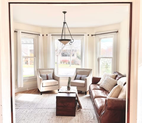 Sun-drenched Living Room view from Dining Room, complete with original pocket doors!