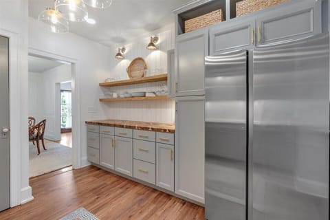The kitchen features plenty of well-organized cabinet space, providing ample storage for all your cooking essentials and keeping everything neatly within reach