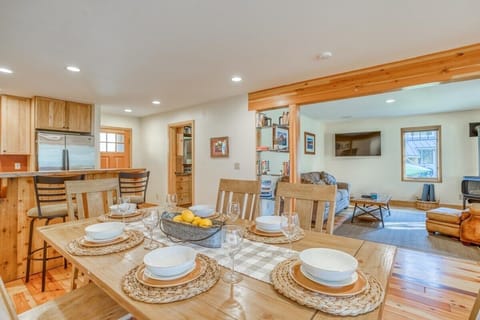 Solid wood dining table with ample room for 6. Spare folding chairs provided.