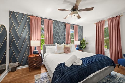 Chic Bedroom Retreat: Enjoy elegant decor and vibrant views in your restful Louisiana escape!