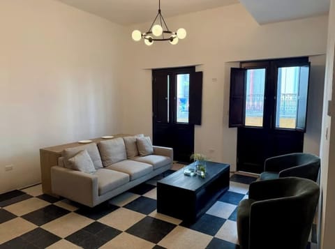 Relax beneath soaring ceilings with timeless Old San Juan character.