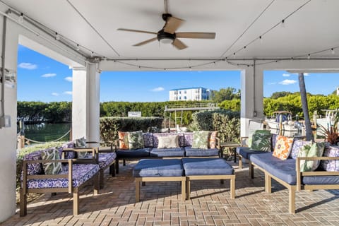 Lounge waterside with plush seating and bright coastal views.