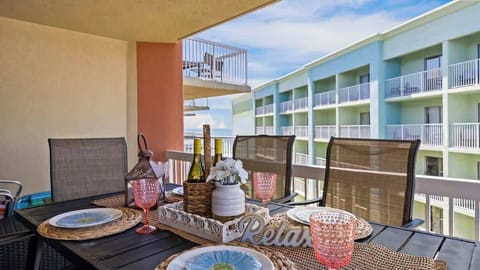 {BALCONY} Enjoy crisp fall breezes and ocean views from the private balcony. Perfect for morning coffee, evening cocoa, or dining al fresco with family while the sun sets over the coast.
