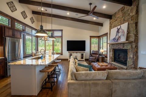 Upper Level - Open concept kitchen, dining and living areas