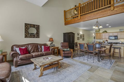 From the patio you see the well-appointed kitchen and overhead loft space. The loft has a cozy seating area w/ full size sleeper sofa.