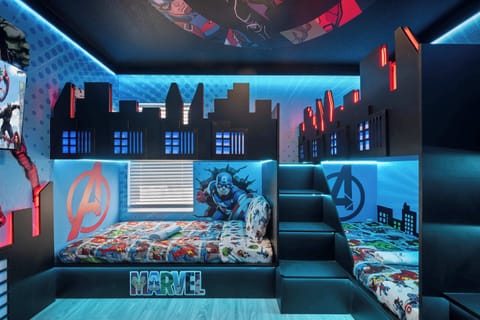 Epic MARVEL themed bedroom with cool blue and red lighting.