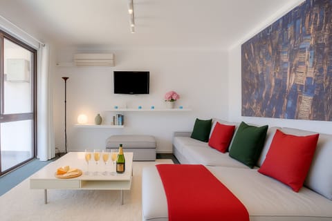 Large couch to relax and catch your favourite shows on the SMART TV connected to unlimited wifi.