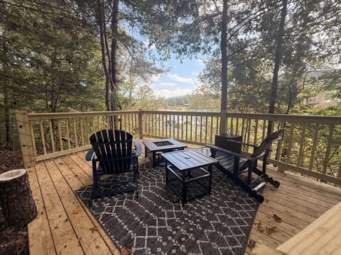 Overlook deck with propane firepit and lounge Adirondack chairs