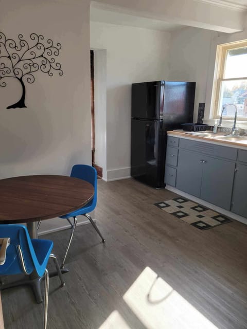 Open the door and enter into the sunny, spacey kitchen.