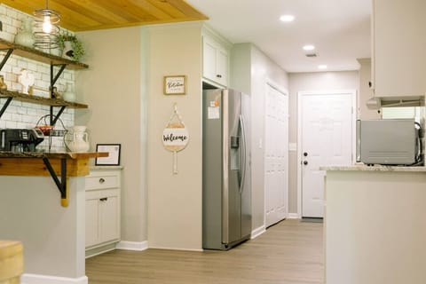Plenty of cabinet space in kitchen | Washer & Dryer next to fridge