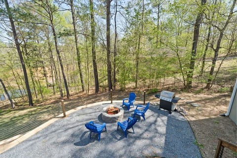 A fire pit is ready for smores and a grill for dinner all while enjoying awesome lake views.
