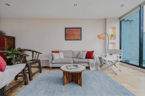Beautifully made timber chairs. Enjoy the view outside, curl up on the sofa to read a book or watch a movie on your 75 inch TV