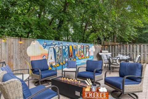 Gather around the fire pit beneath our one-of-a-kind Greetings from Annapolis mural.