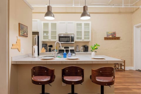 Gather around the kitchen island for morning coffee, shared meals, or late-night chats—this bright and modern space brings everyone together.