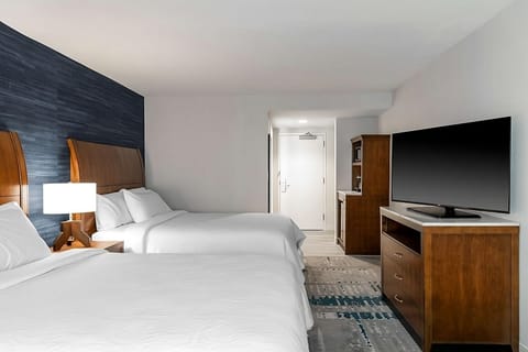Settle into spacious comfort with two beds and HDTV.