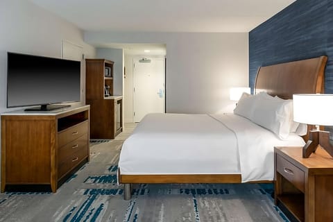 Unwind in crisp linens and a calming, modern room.
