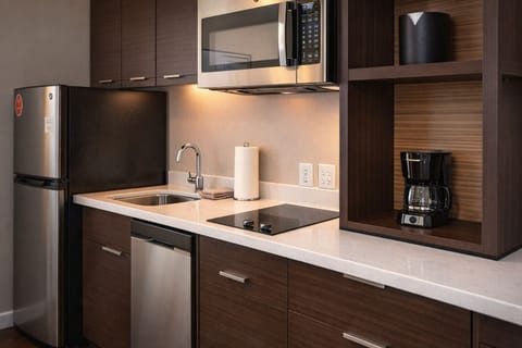 Cook and recharge easily with a sleek, fully equipped kitchenette.