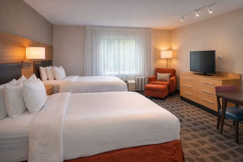 Sink into fresh linens and relax in a bright, quiet room.