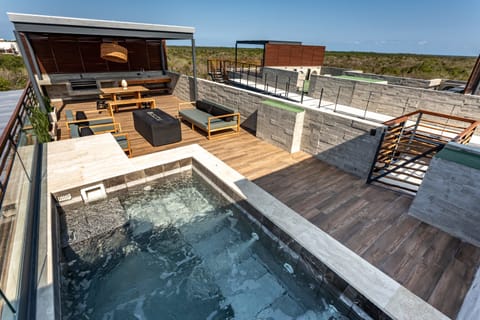 Private rooftop pool with seating for 16 and a firepit. 
