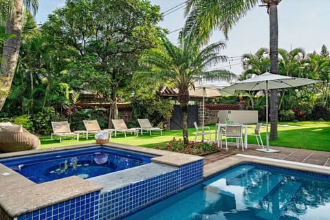 Cuernavaca`s tranquil garden oasis with a sparkling pool and soothing hot tub.