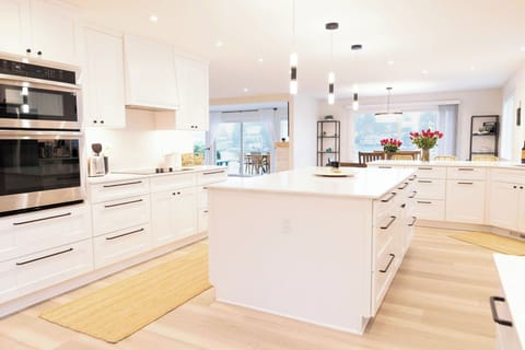 Spacious chef's kitchen with large island and modern appliances 