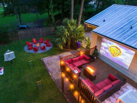 Gather around the string lights for backyard movie nights, complete with a firepit, hammock, and cozy lounge seating