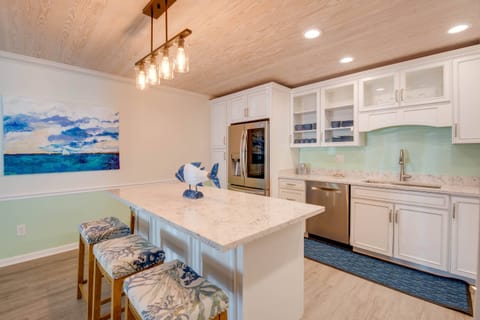 A stylish kitchen island with stools, perfect for casual meals and gathering.