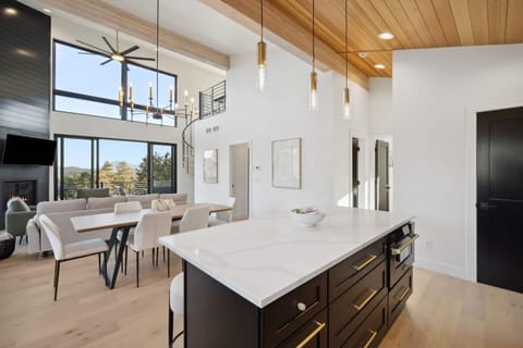 The open dining area feels fresh and airy with wall-to-wall windows.