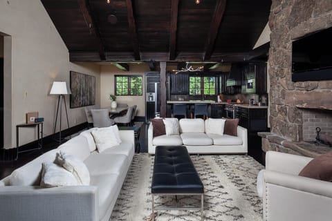 Lounge together in an open great room with rustic warmth.