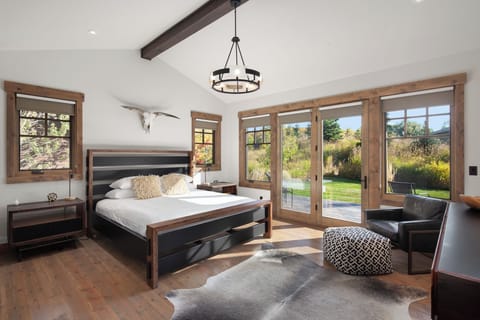 Wake up to sunshine and garden views from this serene suite.