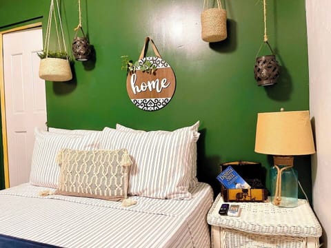 Stylish decor and a unique wall art add a touch of personality to this bedroom.

