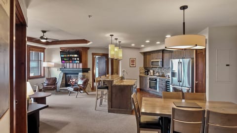 Warm, open living space with plush seating and modern lighting