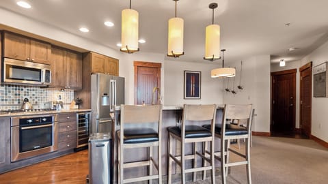 Gourmet kitchen featuring stainless appliances and island seating