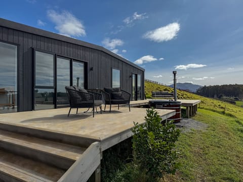 Your serene getaway: farm views and a firewood hot tub under the stars.
