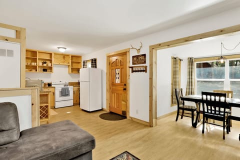 Fully equipped cabin kitchen with ample cabinetry, stove, fridge, microwave, and coffee maker—perfect for cooking meals, morning coffee, and feeling right at home on your stay.
