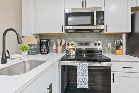 Stainless steel appliances add a sleek, modern touch.