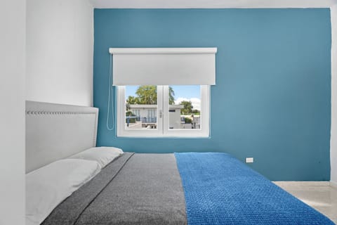 Tranquil bedroom with crisp linens and a minimalist design for ultimate relaxation.